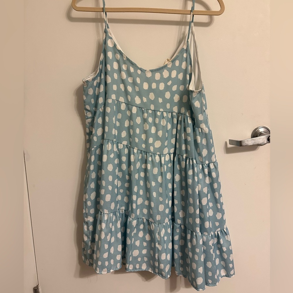 Bright and playful light blue patterned mini dress. Size large.